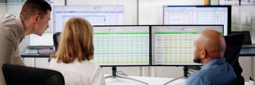 Analyst,Employee,Working,On,Spreadsheet,Using,Desktop,Computer